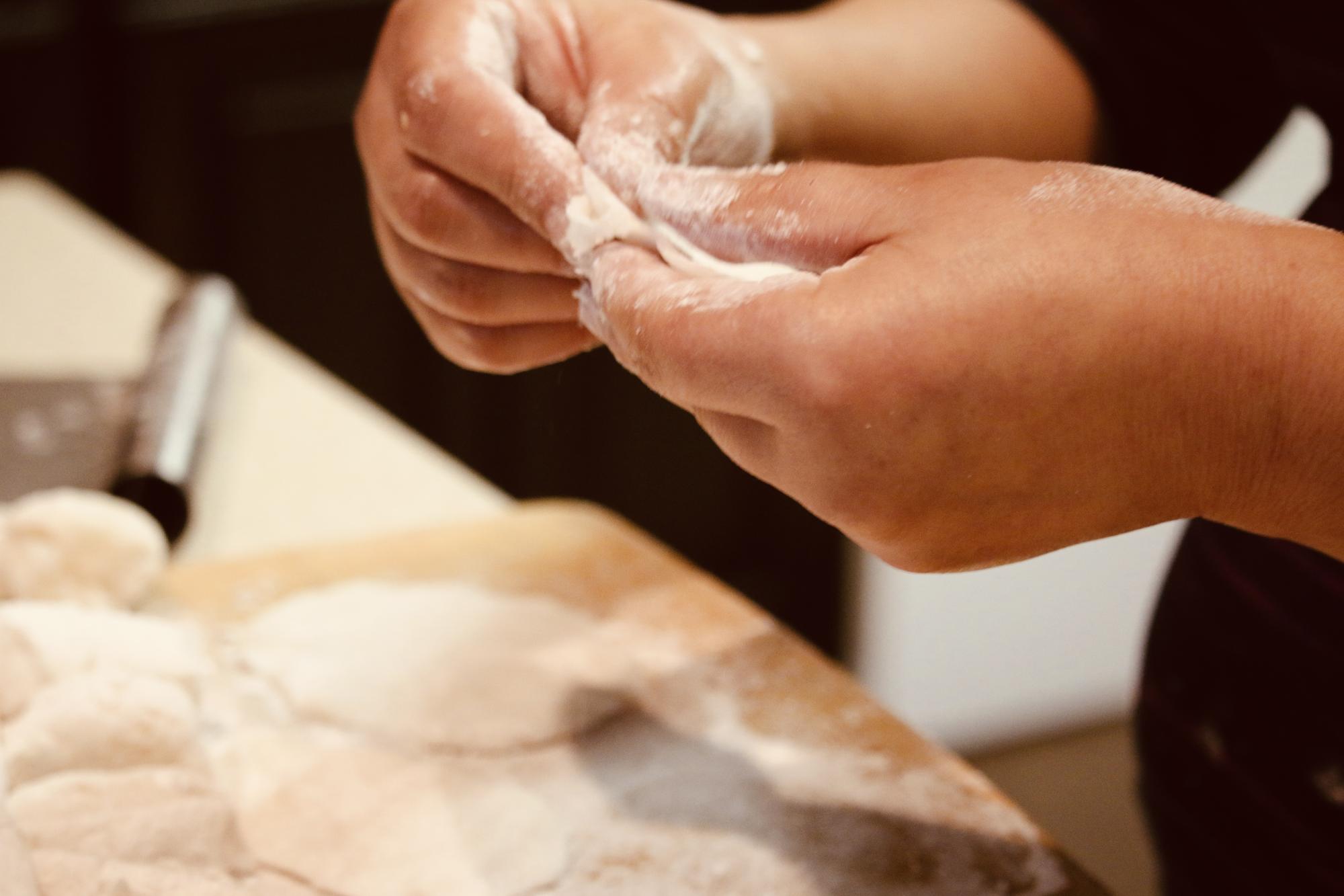 Student shaping dough